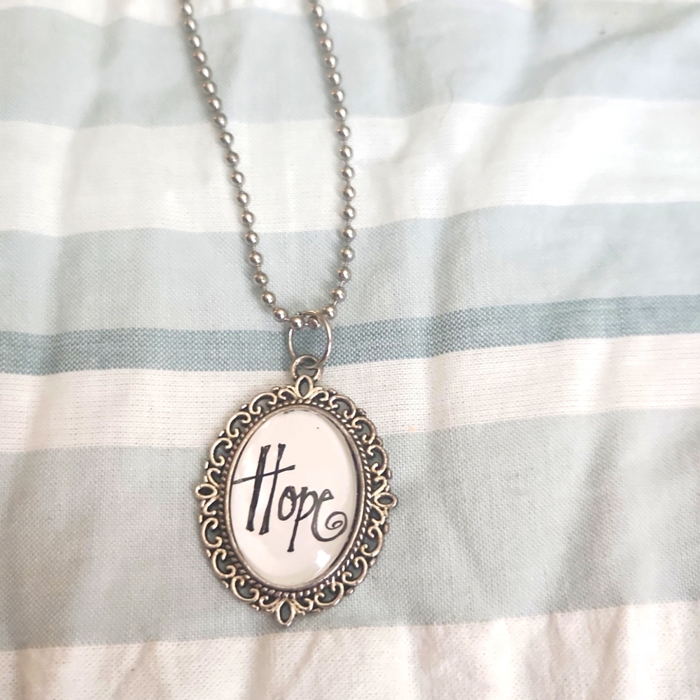 Hope pendant necklace with a silver color 13 in chain.